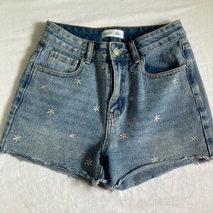 Khaki Blue Daisy denim shorts. Size 27/5. Color is blue with daisys